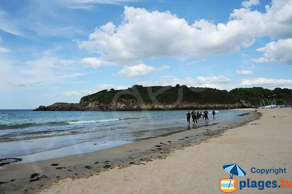 Surfers on the beach of St Lunaire