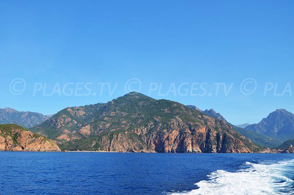 Bussaglia beach in Corsica from the sea with Porto