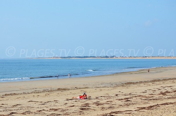 Beach in St Georges d'Oléron and view on Chassiron lighthouse