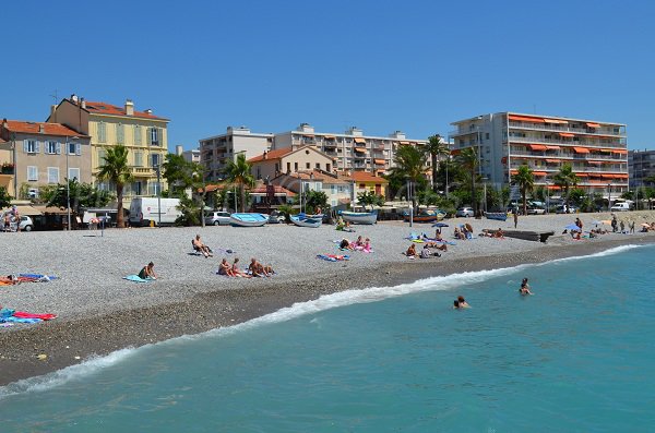 Stone beach in Cagnes sur Mer and fishing boats