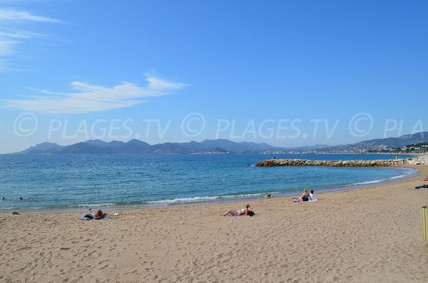 Midi beach in Cannes and view on the Esterel massif