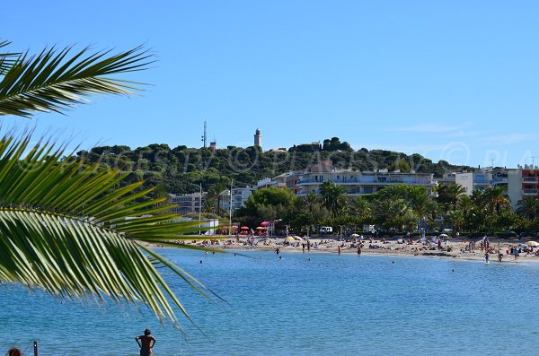 Ponteil beach and view on the lighthouse of the Cap d'Antibes